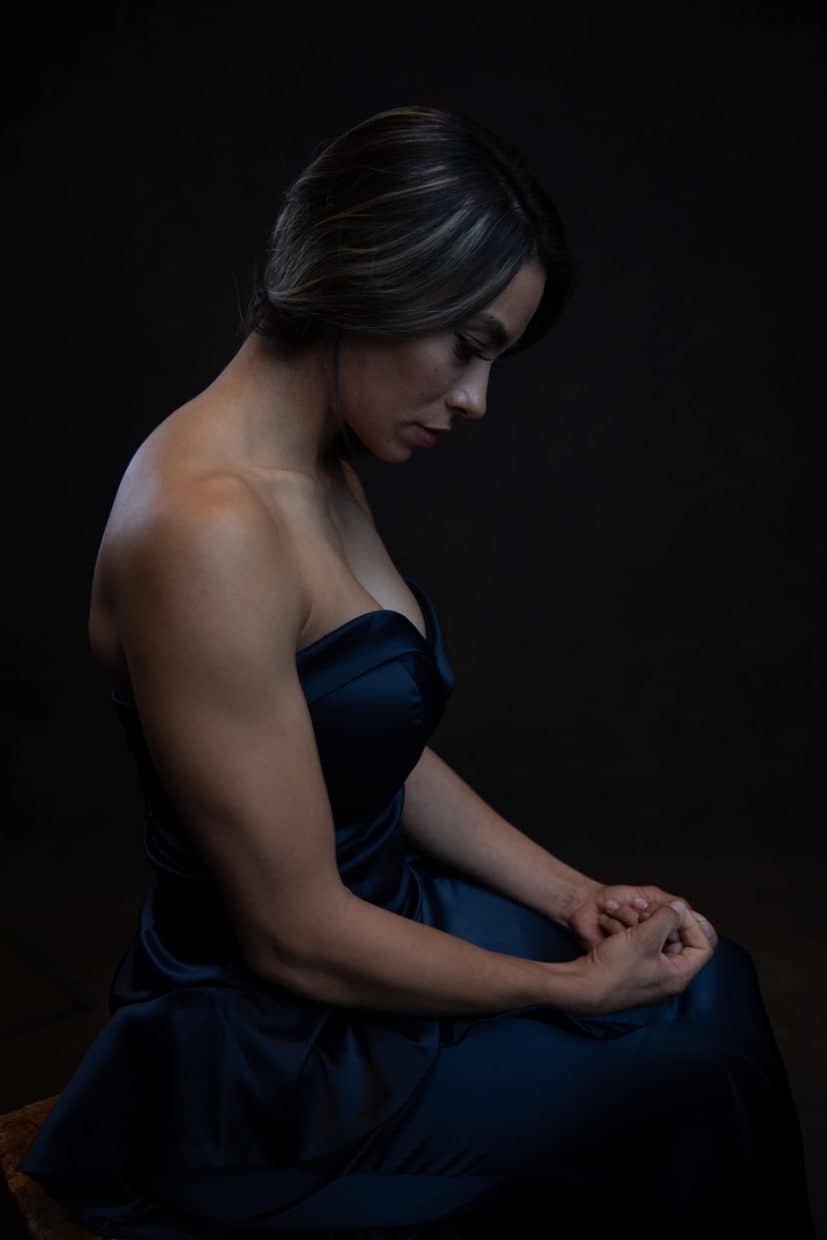 Stonetree Creative - Woman sitting for a portrait looking sad