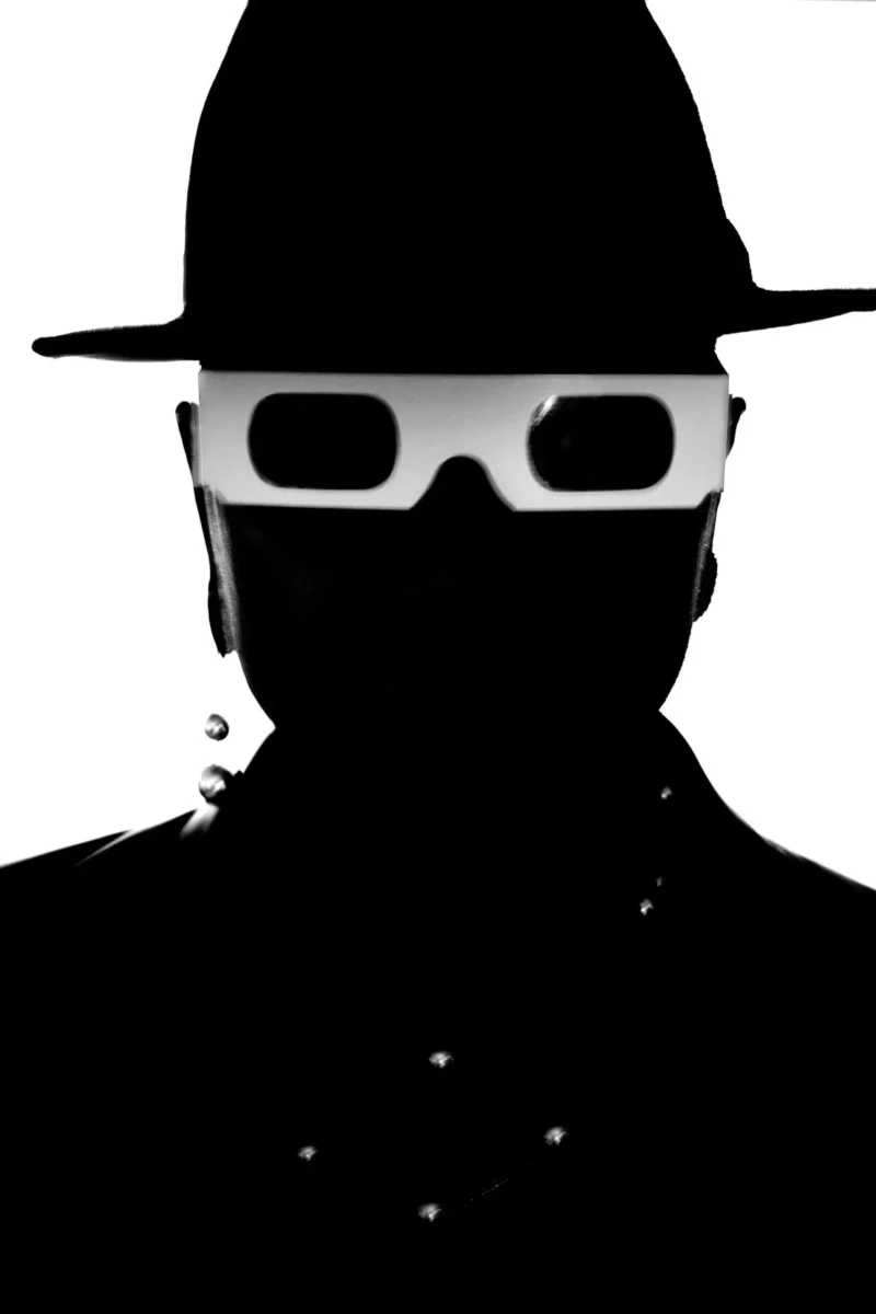 silhouette of man in glasses
