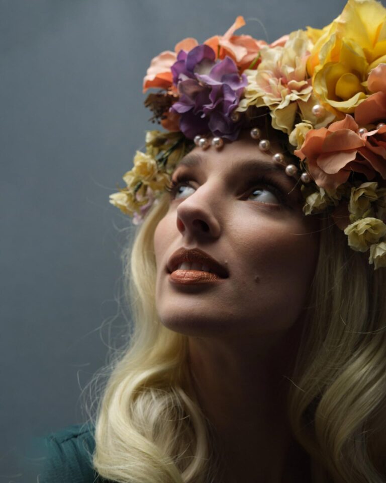 portrait of woman in floral headpiece before retouching