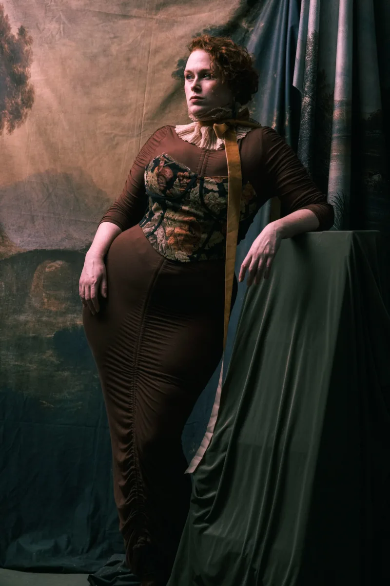 fine art portrait of woman in maroon dress